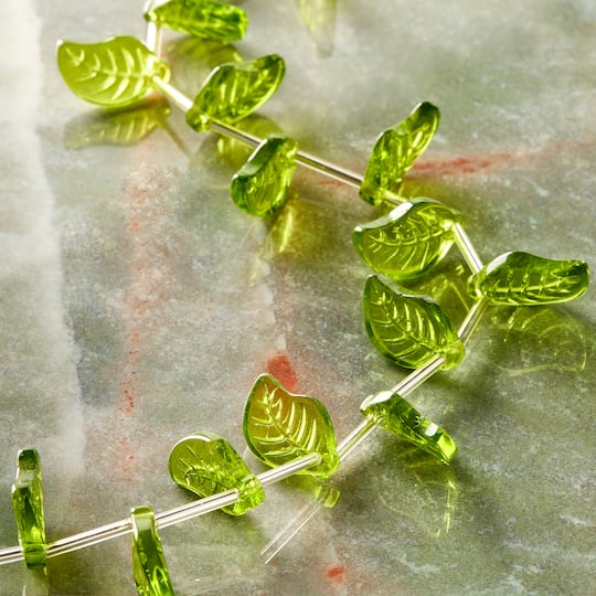 12 Pack: Peridot Green Glass Leaf Beads, 18mm by Bead Landing™